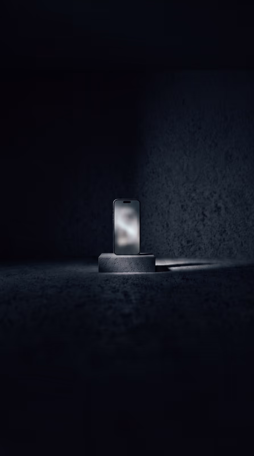 A phone standing upright on a plinth